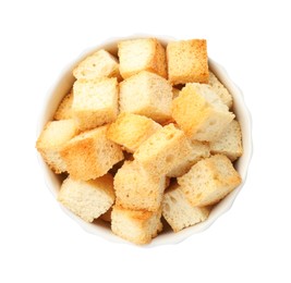 Photo of Delicious crispy croutons in bowl isolated on white, top view