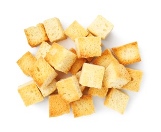 Photo of Many delicious crispy croutons isolated on white, top view