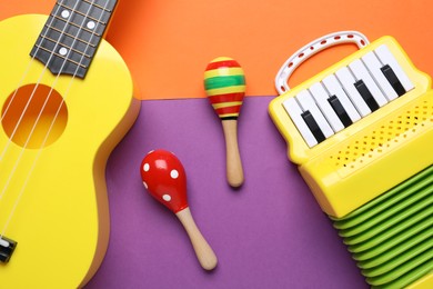 Photo of Different toy musical instruments on color background, flat lay