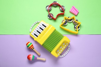 Photo of Different toy musical instruments on color background, flat lay