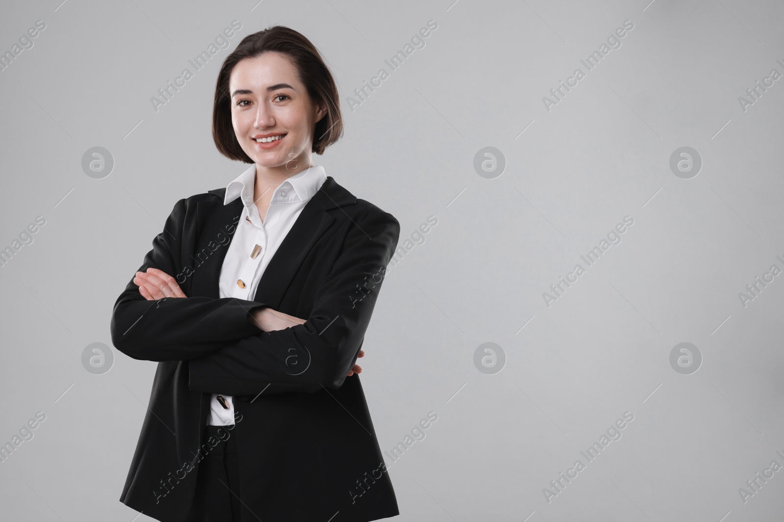 Photo of Portrait of confident secretary on grey background. Space for text