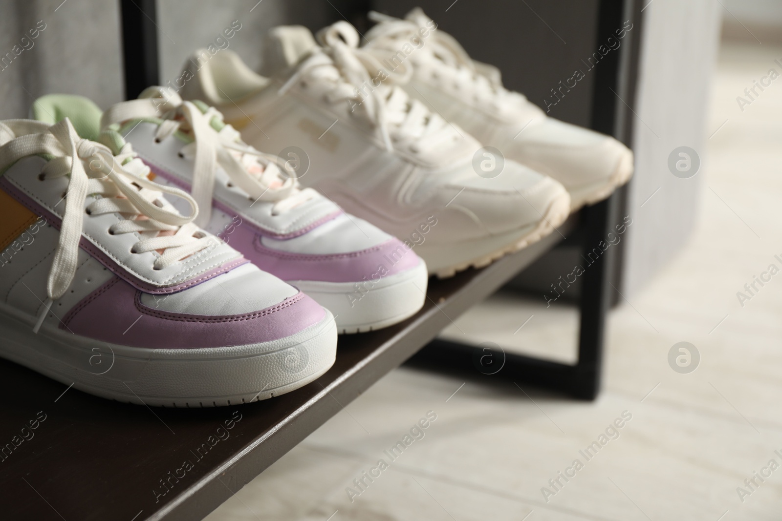Shoe storage. Shelving unit with different footwear indoors, closeup Photo of Shoe storage. Shelving unit with different footwear indoors, closeup