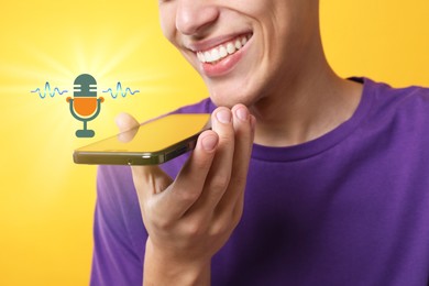 Young man recording voice message via smartphone on yellow background, closeup. Illustration of microphone and sound waves