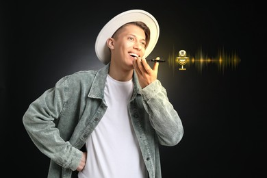 Image of Young man recording voice message via smartphone on black background. Illustration of microphone and sound waves