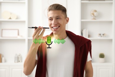 Young man recording voice message via smartphone at home. Illustration of microphone and sound waves