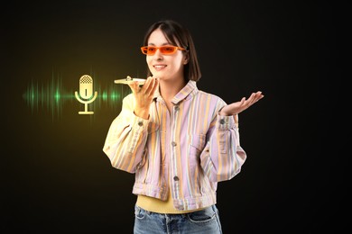 Image of Young woman recording voice message via smartphone on black background. Illustration of microphone and sound waves