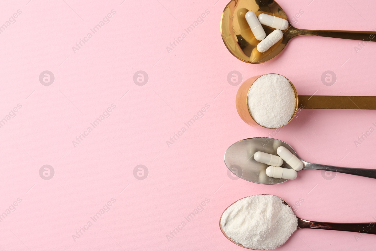 Collagen powder and pills on pink background, flat lay. Space for text Photo of Collagen powder and pills on pink background, flat lay. Space for text