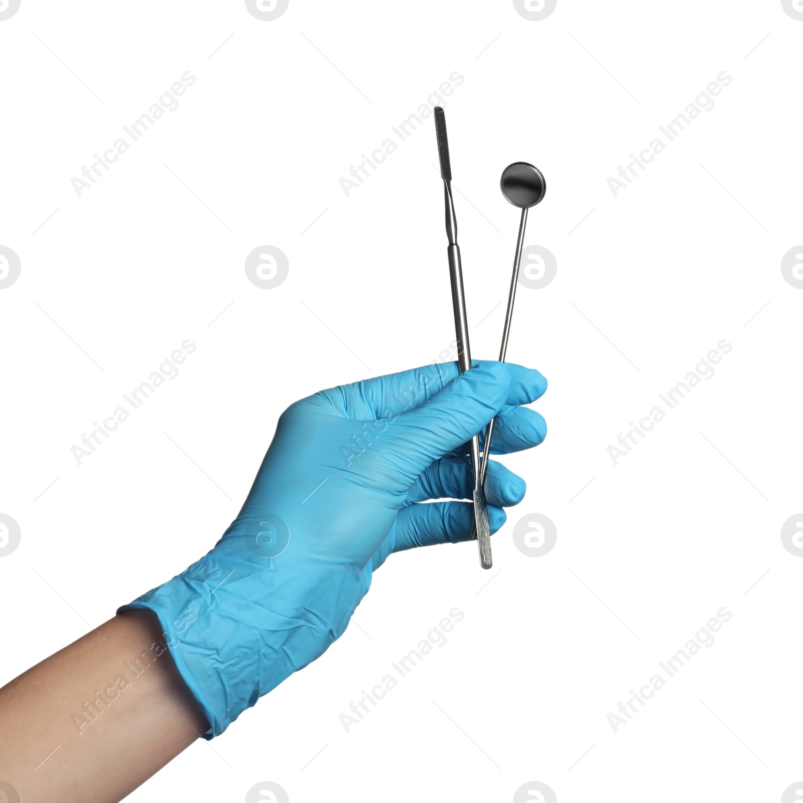 Photo of Doctor in medical glove holding metal tools on white background, closeup