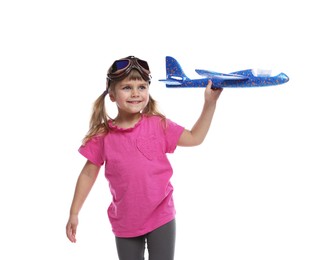 Cute little girl playing with toy plane on white background