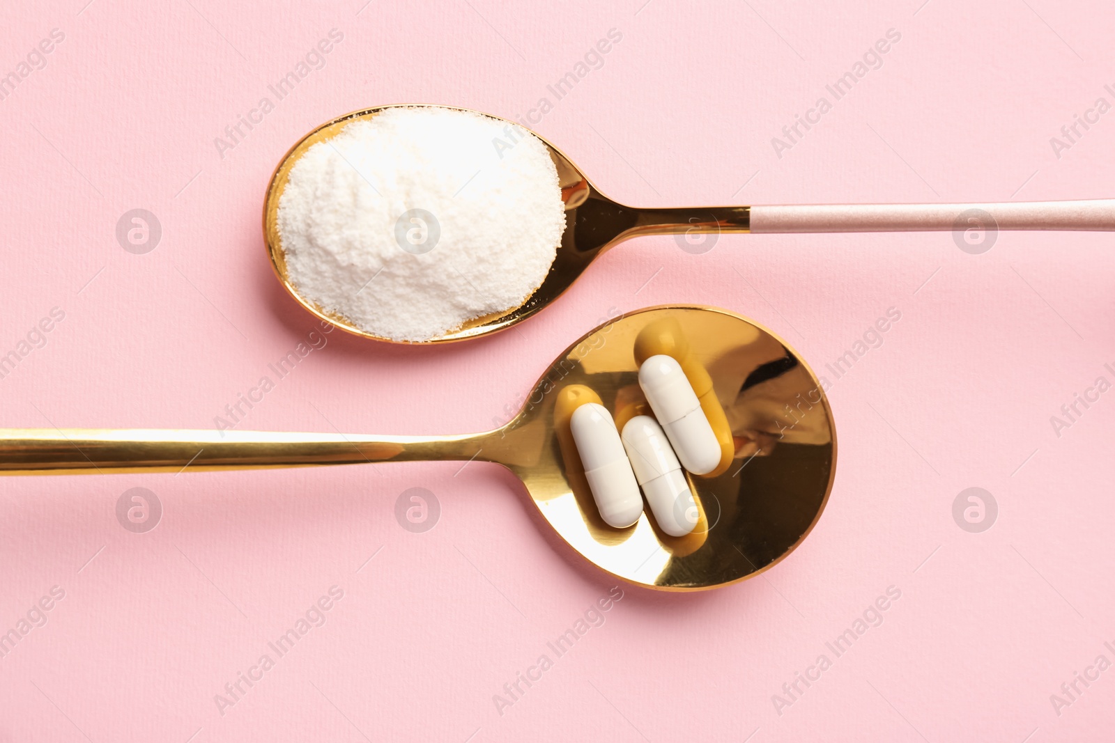 Collagen powder and pills on pink background, flat lay. Food supplement Photo of Collagen powder and pills on pink background, flat lay. Food supplement