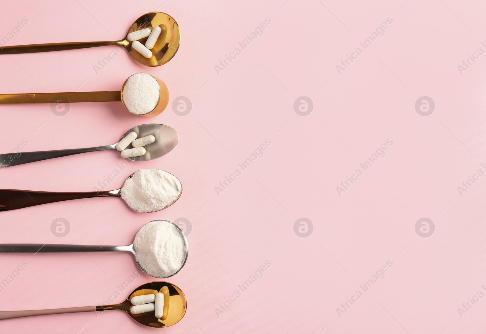 Collagen powder and pills on pink background, flat lay. Space for text Photo of Collagen powder and pills on pink background, flat lay. Space for text