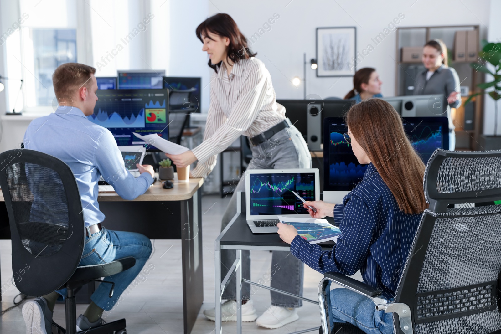 Photo of Stock exchange. Business team working together in office