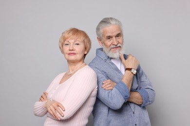 Photo of Portrait of lovely senior couple on grey background