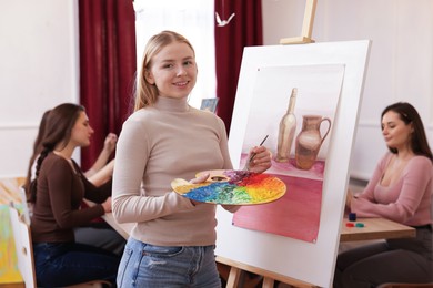 Photo of Group of women learning to draw in class