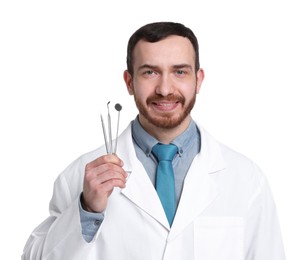 Photo of Professional dentist with tools on white background