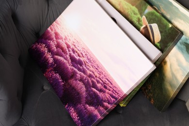 Photo of Canvas with different printed photos on armchair indoors, closeup