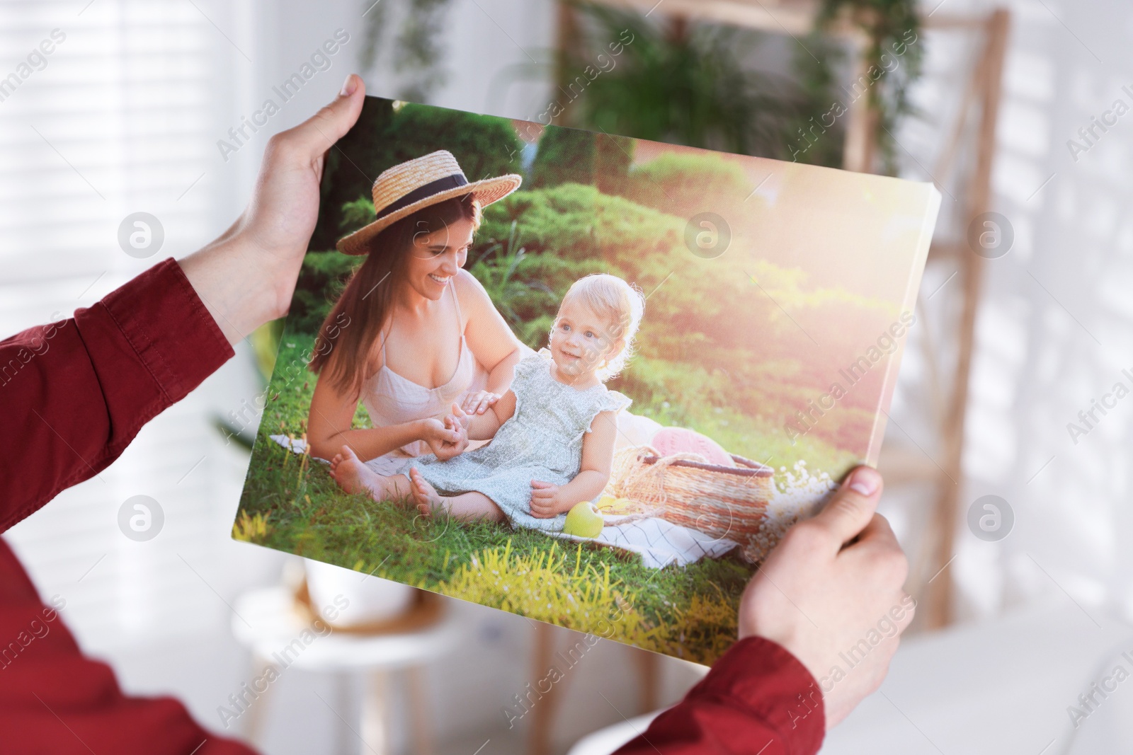 Photo of Canvas print. Woman with photo at home, closeup