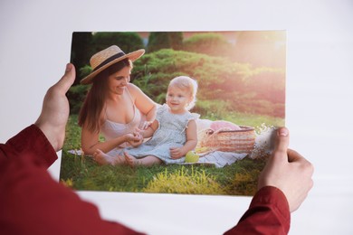 Photo of Canvas print. Woman with photo on light background, closeup