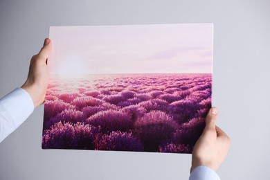 Photo of Canvas print. Woman with photo on light background, closeup