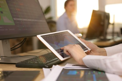 Photo of Stock exchange. Woman working at desk in office, closeup