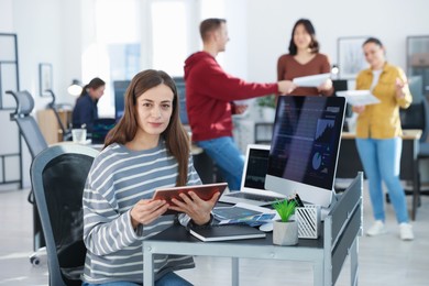 Photo of Stock exchange. Woman working at desk in office