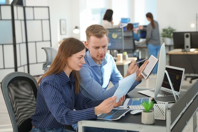 Photo of Stock exchange. Colleagues working together in office