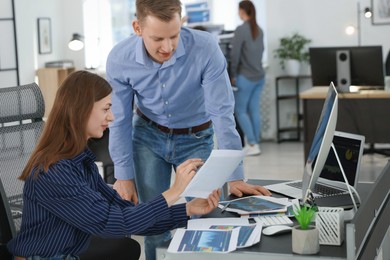 Photo of Stock exchange. Colleagues working together in office