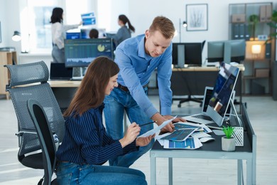 Photo of Stock exchange. Colleagues working together in office