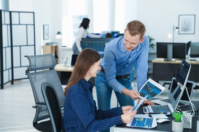 Photo of Stock exchange. Colleagues working together in office