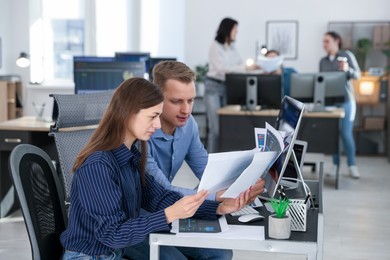 Photo of Stock exchange. Colleagues working together in office