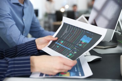 Photo of Stock exchange. Colleagues working together in office, closeup