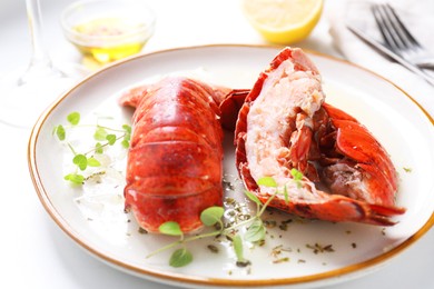 Photo of Delicious tails of boiled lobsters served on white table, closeup