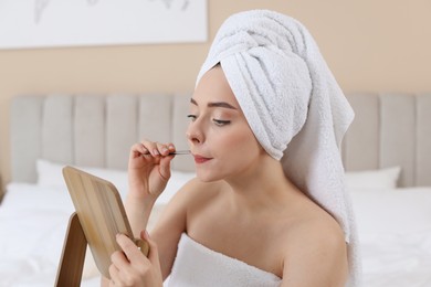 Photo of Beautiful woman plucking her mustache with tweezers at home