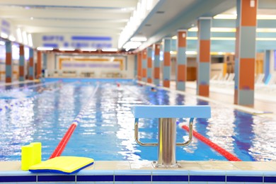 Photo of Swimming pool with clean water and lane dividers indoors