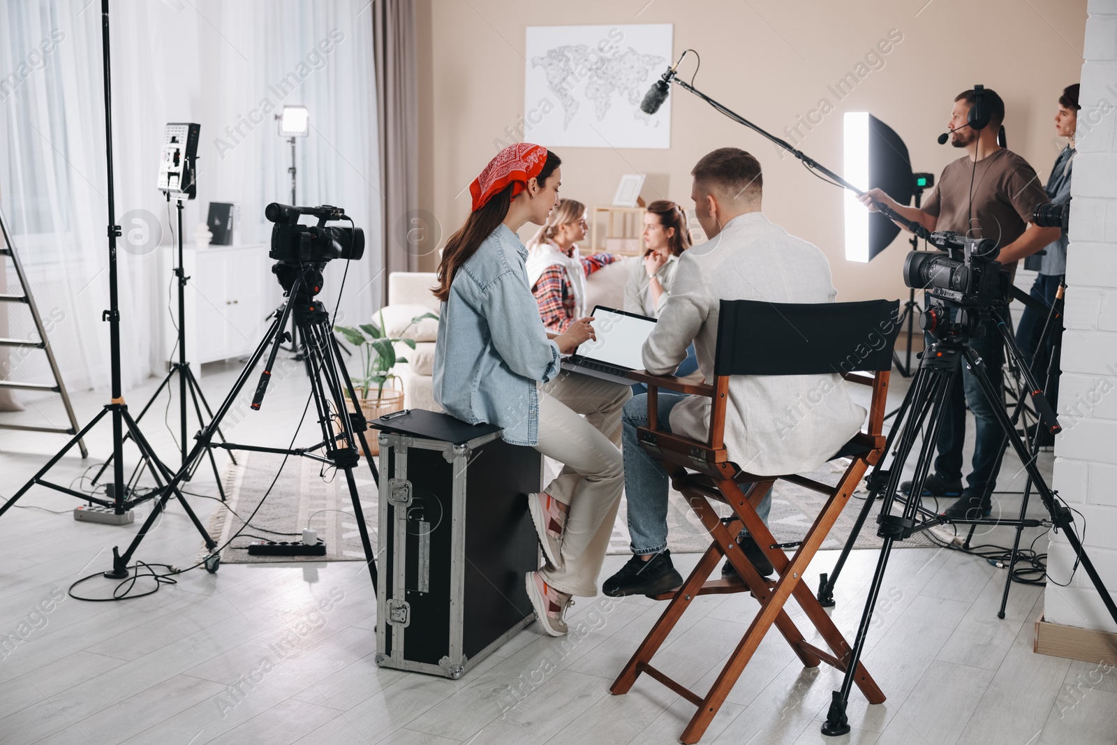 Photo of Group of people working in modern film studio