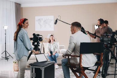 Photo of Group of people working in modern film studio