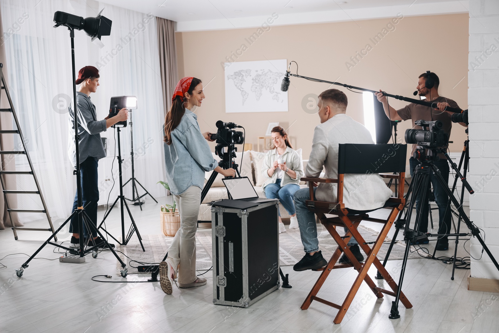 Photo of Group of people working in modern film studio