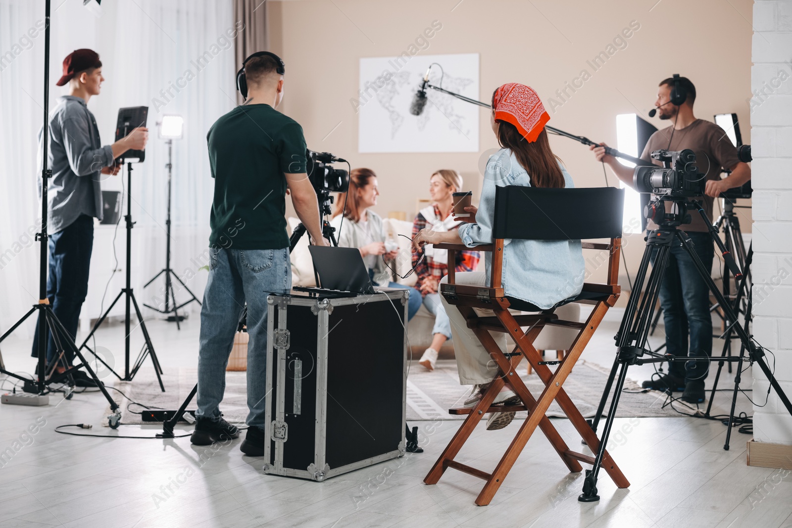 Photo of Group of people working in modern film studio