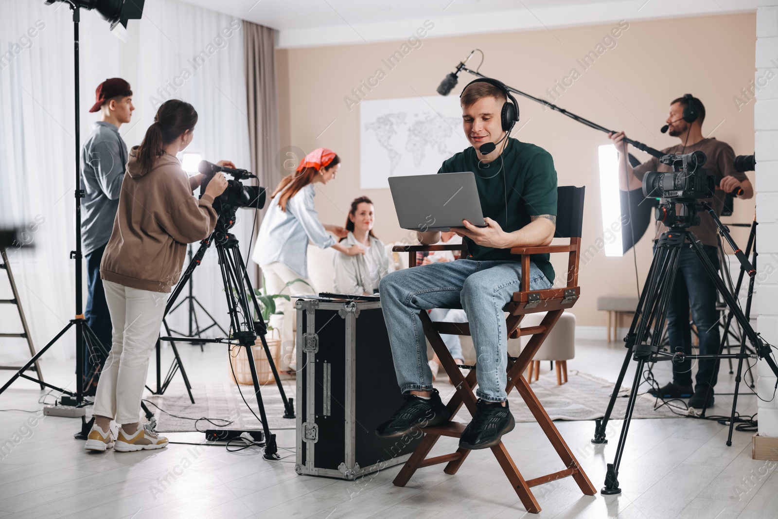 Photo of Group of people working in modern film studio