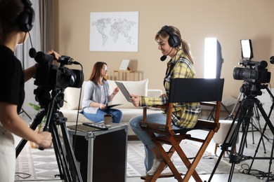 Photo of Group of people working in modern film studio