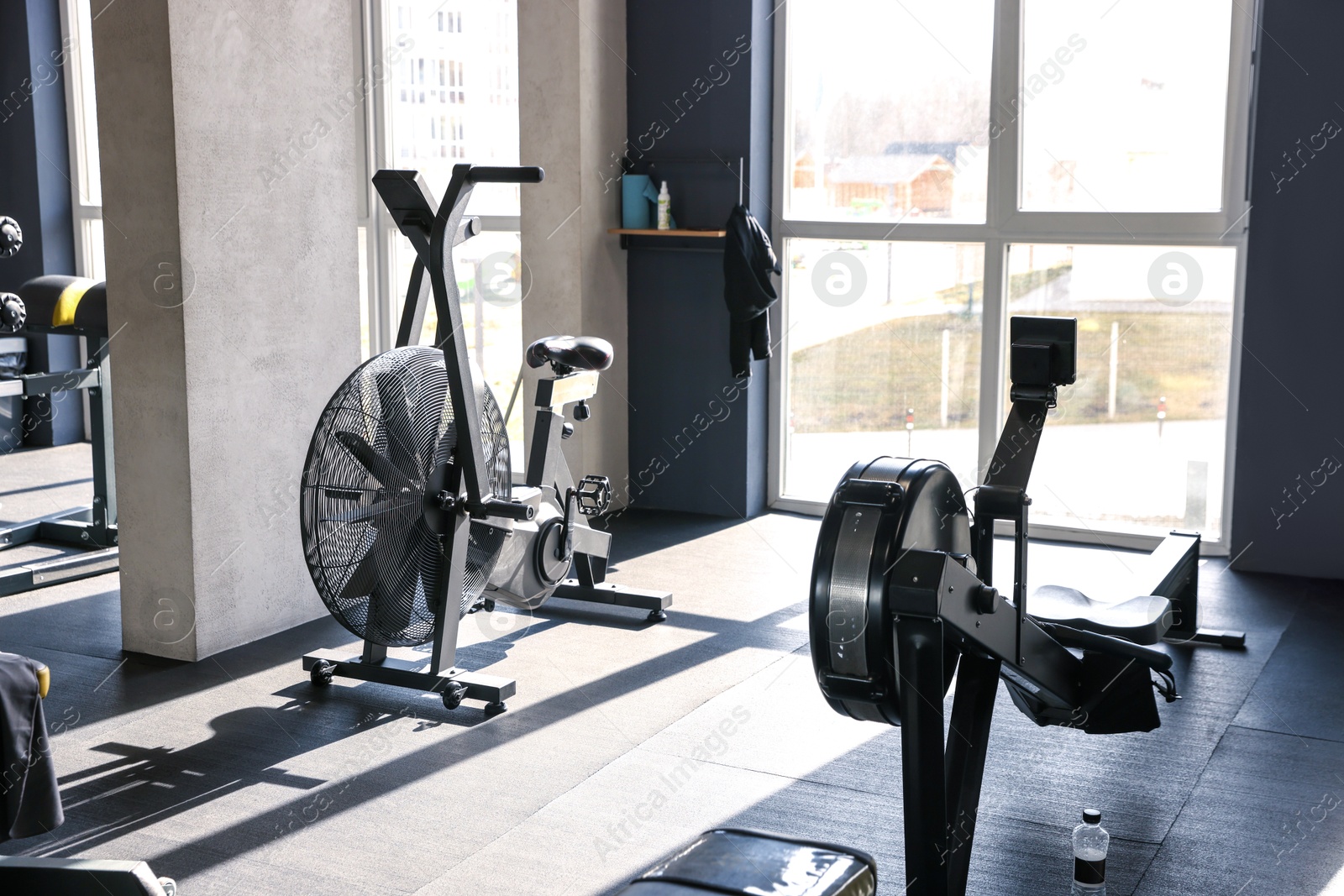 Photo of Professional equipment near window in sport gym