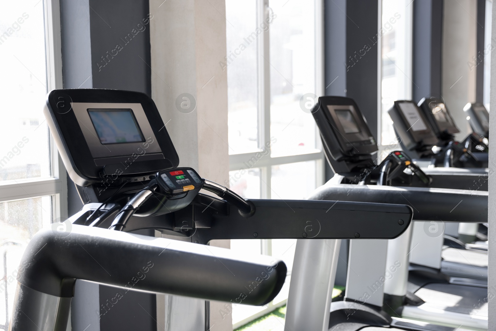 Photo of Different many treadmills in gym. Sport equipment