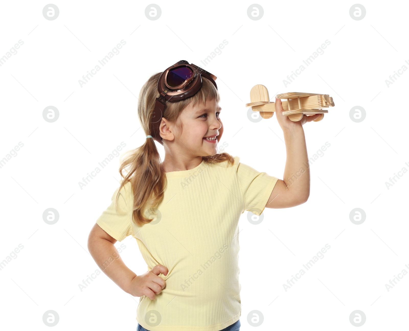 Photo of Happy little girl with toy plane on white background