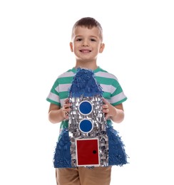 Photo of Happy boy with rocket shaped pinata on white background