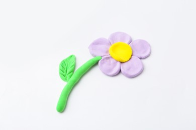 Photo of Flower made from play dough on light grey background