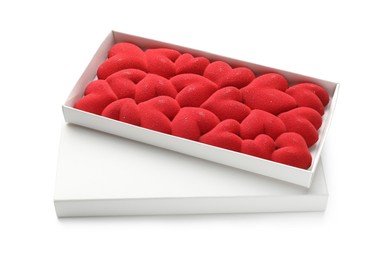 Photo of Chocolate bar decorated with hearts in box isolated on white