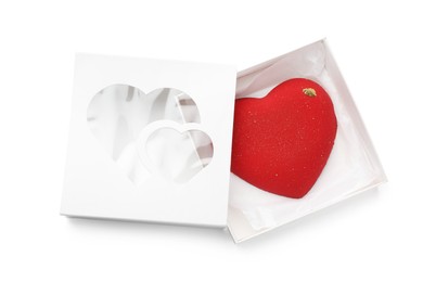 Photo of Heart shaped chocolate in box isolated on white, top view