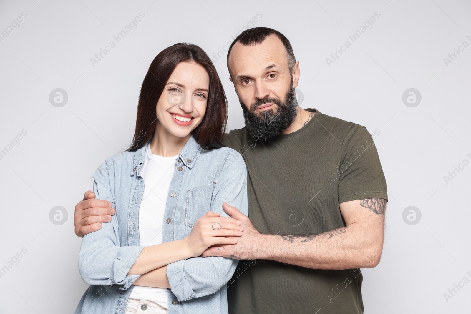 Photo of Portrait of happy daughter and father on light grey background