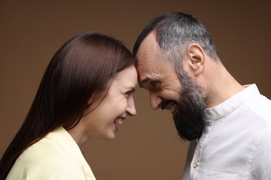 Photo of Happy daughter and father on brown background