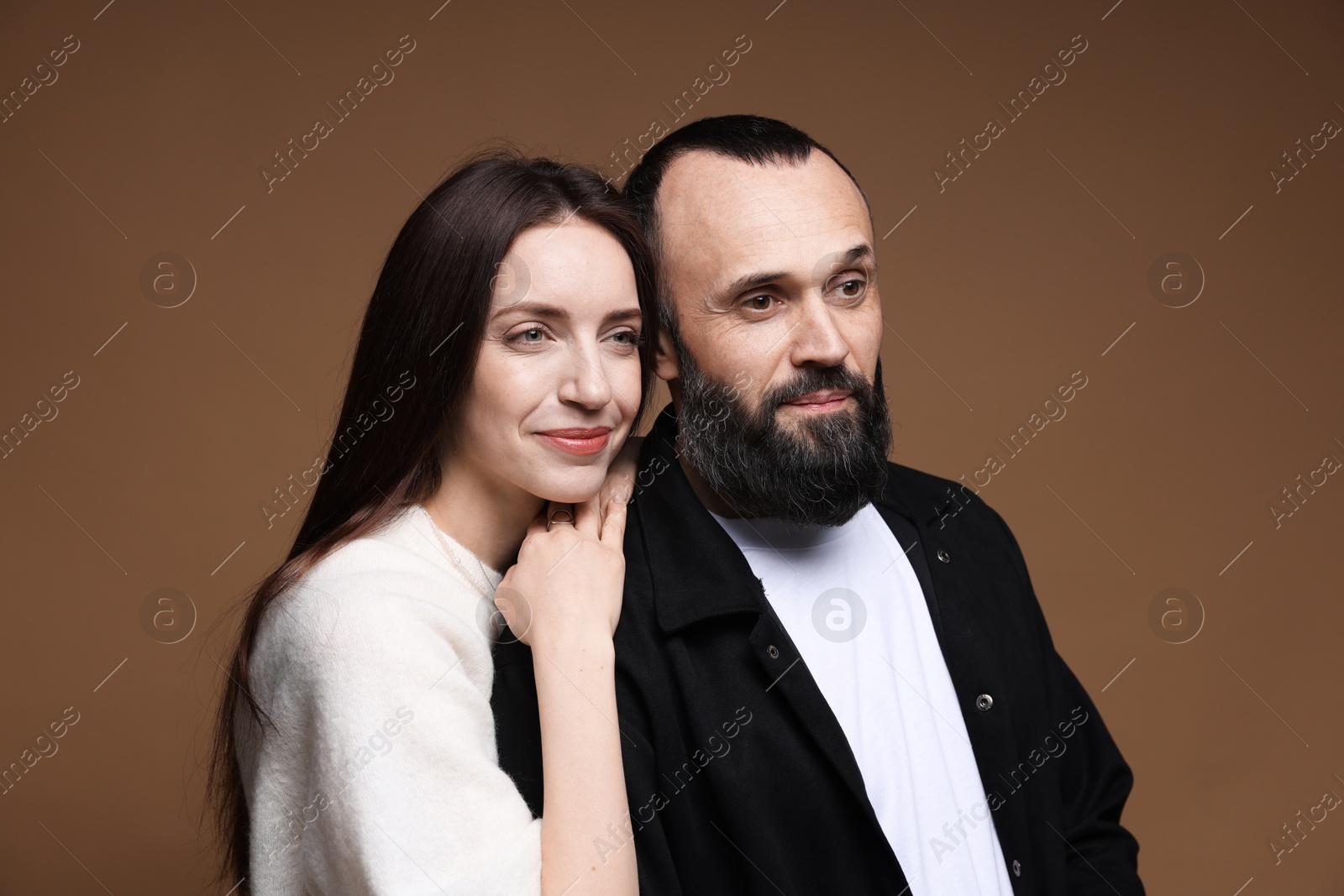 Photo of Happy daughter and father on brown background